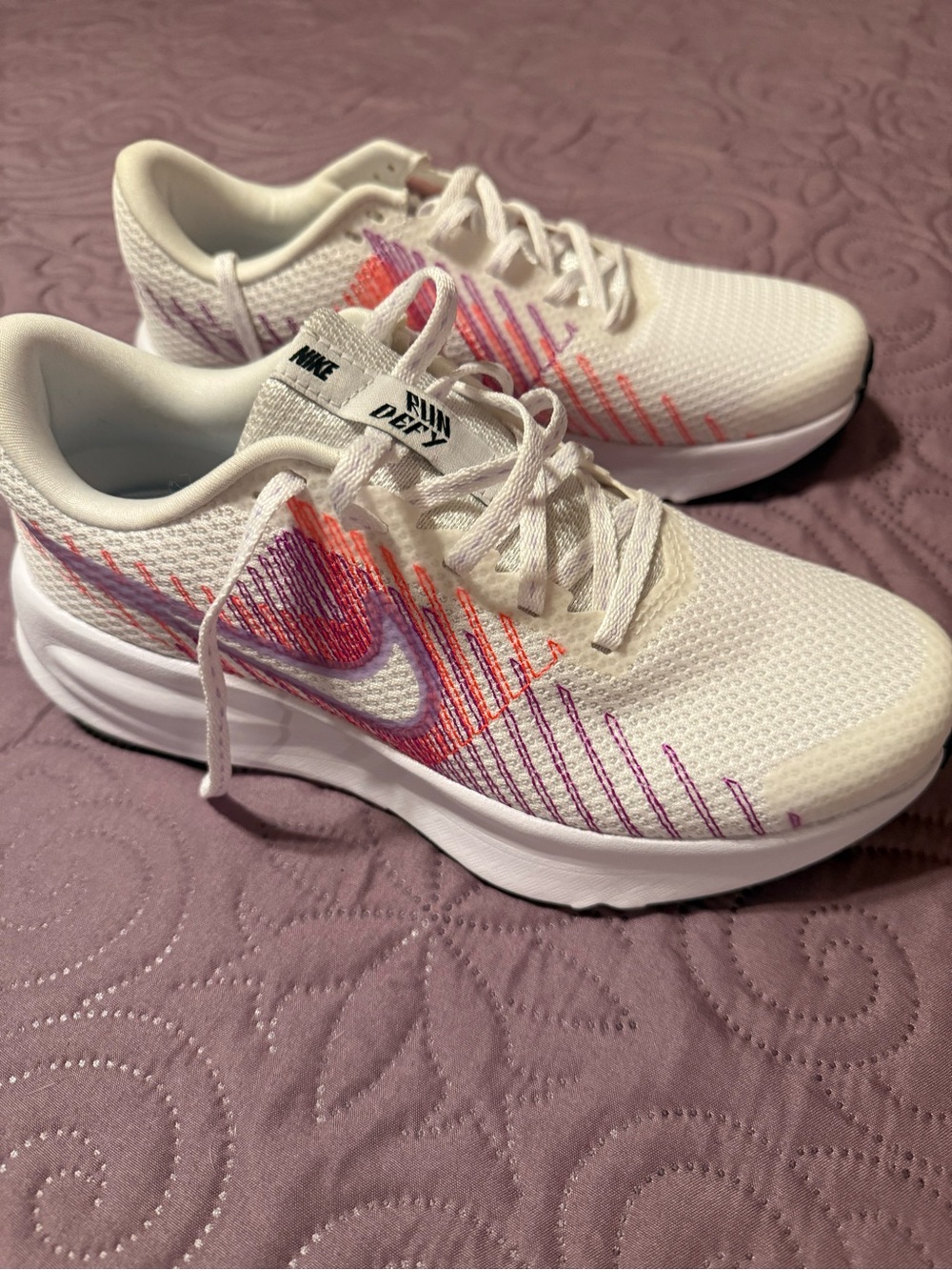 Nike Women's White Running Sneakers with Pink & Orange Stitch Accents